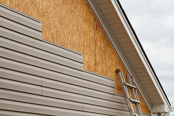 Professional Siding Replacement technician working in Adamsville, PA